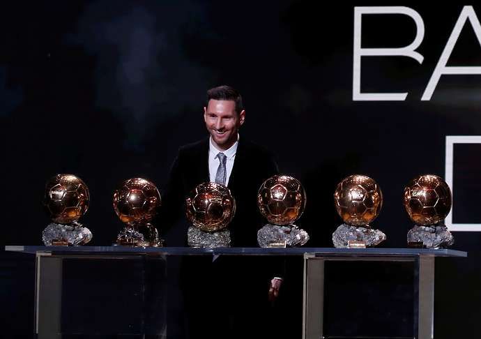 Messi with his Ballon d'Ors