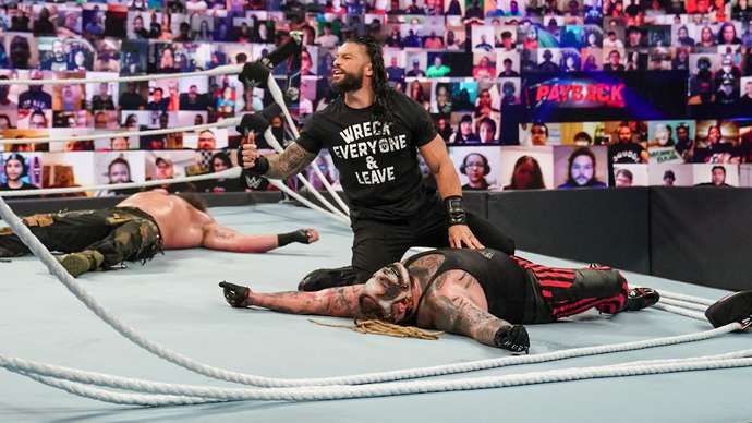 Reigns hit Wyatt with a low blow