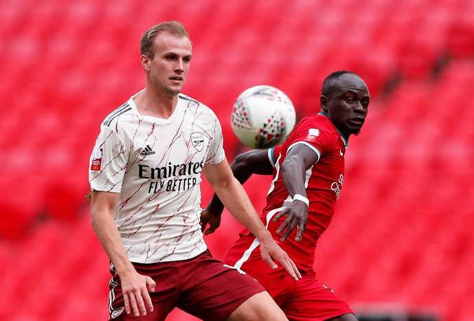 Rob Holding keeps the ball from Sadio Mane