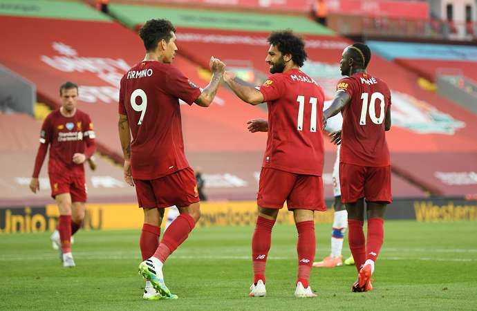 Liverpool's Mohamed Salah, Roberto Firmino and Sadio Mane celebrate