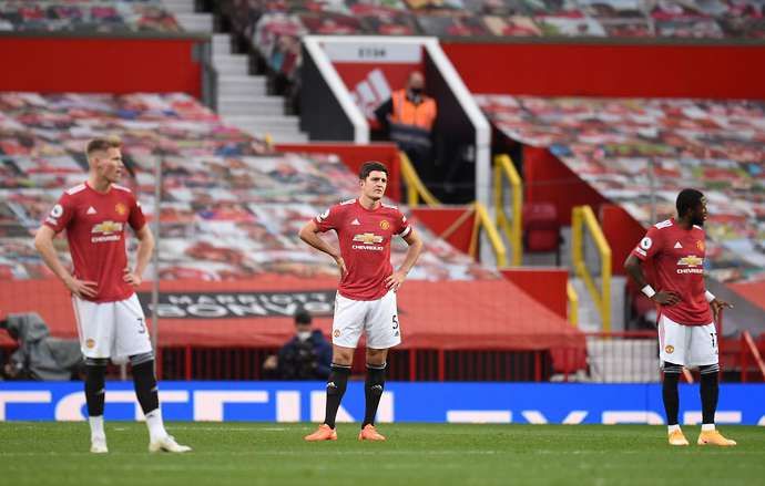 Harry Maguire stares in disbelief as Man United lose to Tottenham