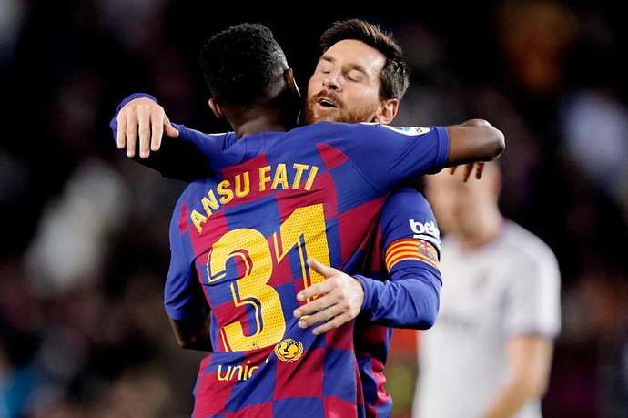 Ansu Fati & Lionel Messi embrace