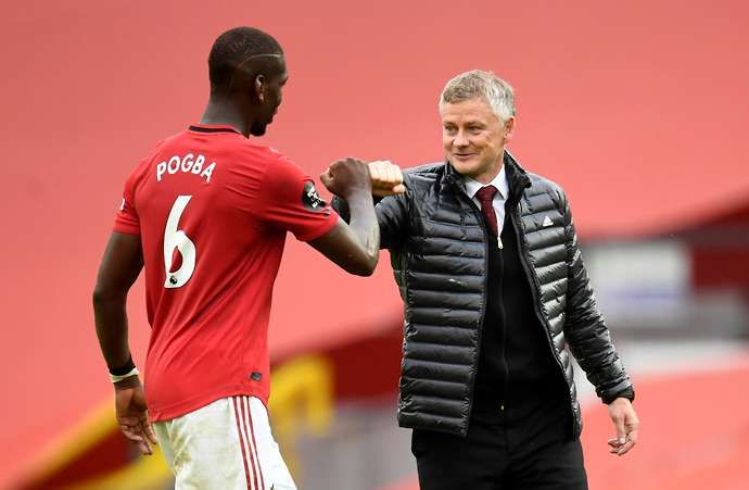Paul Pogba and Ole Gunnar Solskjaer in action for Man United