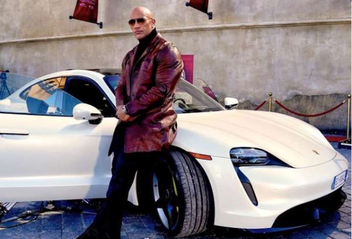 The Rock can fit outside his car, but not inside it