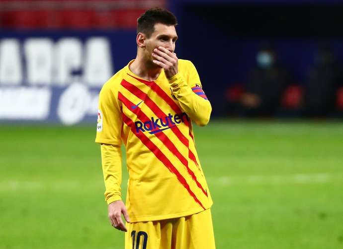 Messi looks on