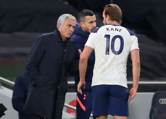Tottenham manager Jose Mourinho talks with England captain Harry Kane