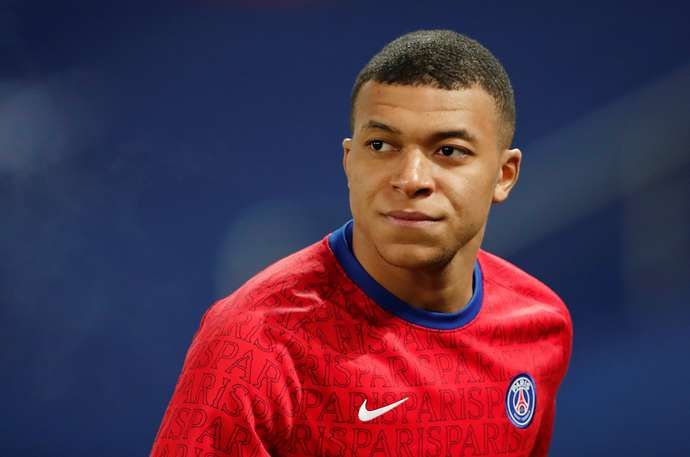 Mbappe warms up
