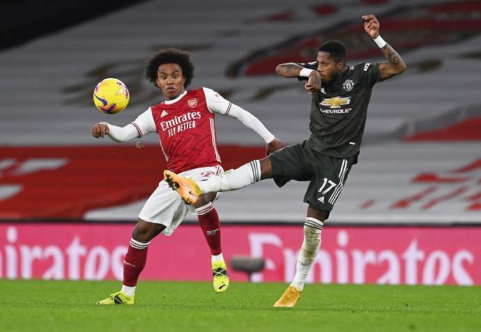 Willian and Fred in action during Arsenal vs Man Utd