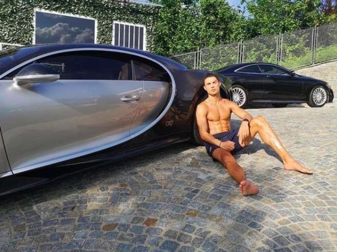 Ronaldo and two of his cars