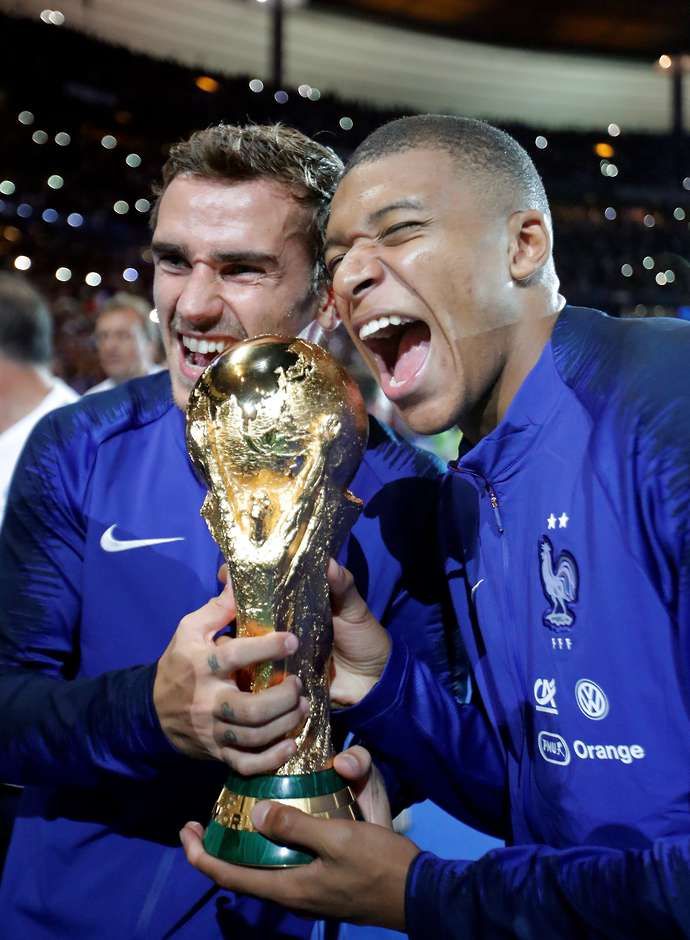 Griezmann & Mbappe with the WC trophy