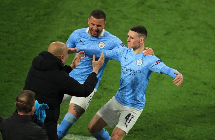 Phil Foden celebrates his goal for Man City vs Dortmund with Pep Guardiola