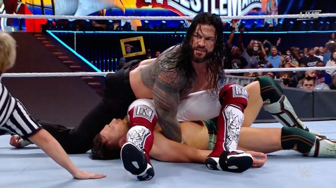 Reigns pinned both Bryan and Edge at WrestleMania