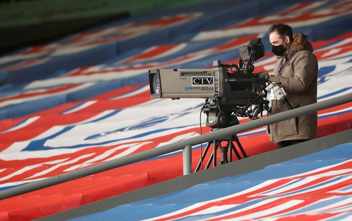 Television camera operator inside the stadium before the match