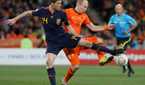 Xabi Alonso and Arjen Robben in 2010 World Cup final