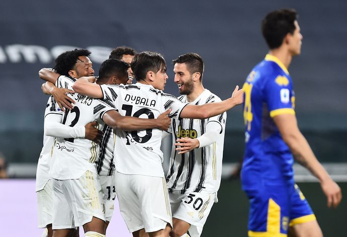 Juventus teammates, including Paulo Dybala, celebrate a goal