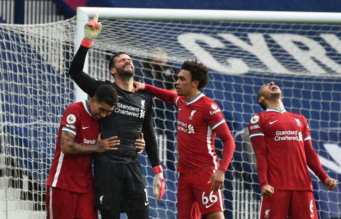 Alisson celebrates his goal for Liverpool vs West Brom