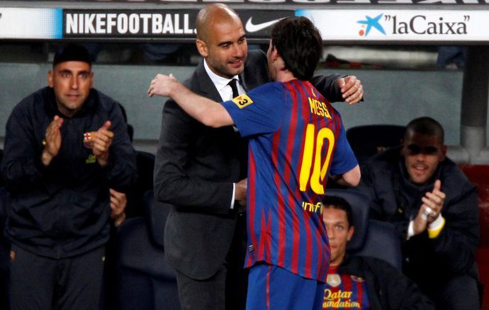 Guardiola and Messi embrace