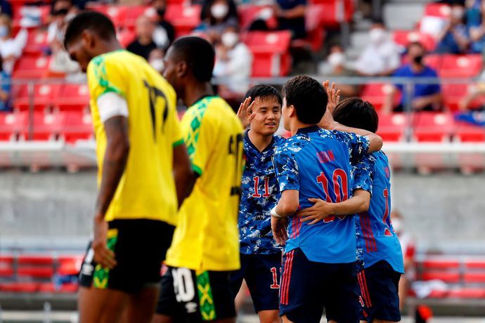 Takefusa Kubo celebrates with teammates in Japan U24s vs Jamaica