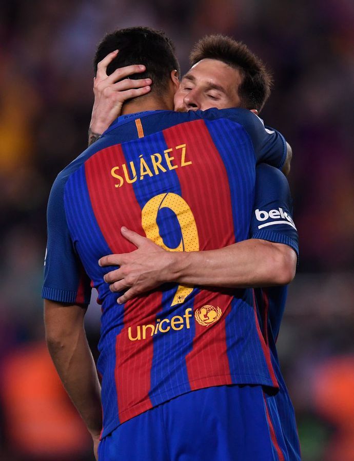 Luis Suarez and Lionel Messi in action for Barcelona