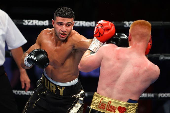 Tommy Fury (L) punches Jordan Grant during the Light Heavyweight fight between Tommy Fury and Jordan Grant at Telford International Centre on June 05, 2021 in Telford, England. (Photo by Richard Heath