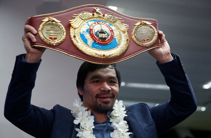 Manny Pacquiao showing off his world championship belt