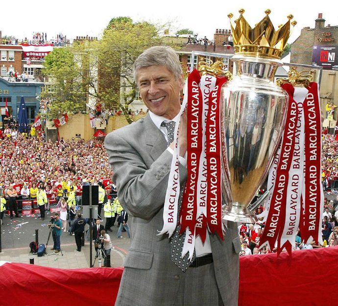 Arsene Wenger parades the Premier League trophy after winning it at Arsenal