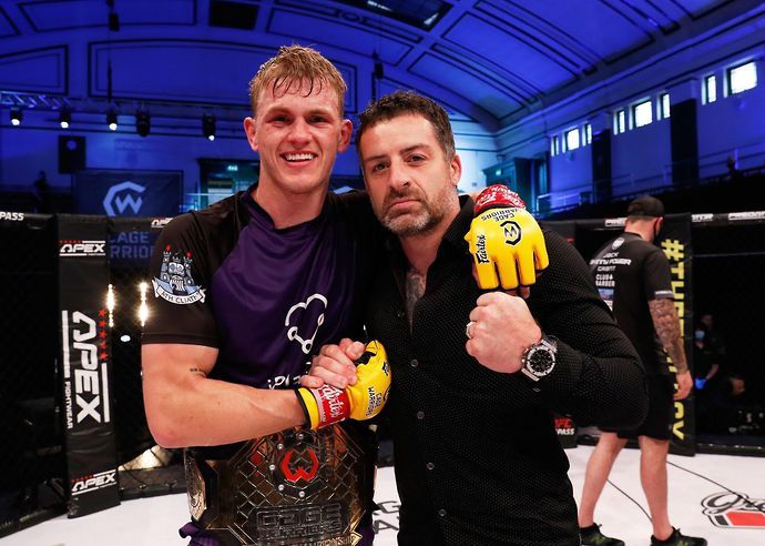 Ian Garry celebrates with Cage Warriors president Graham Boylan after beating Jack Grant