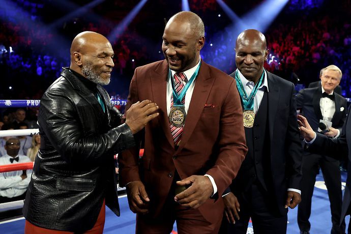 Mike Tyson pictured with Evander Holyfield and Lennox Lewis
