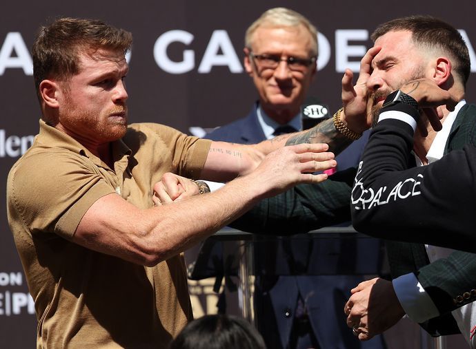 Canelo Alvarez and Caleb Plant had to be pulled apart on stage