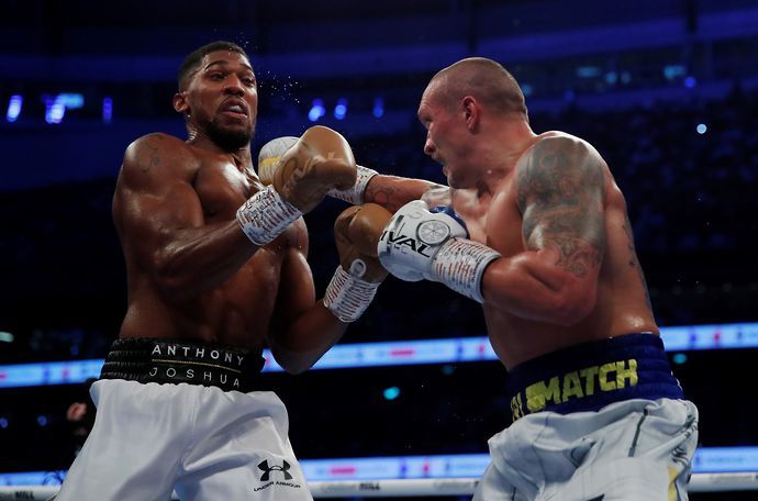 Oleksandr Usyk throws a punch at Anthony Joshua
