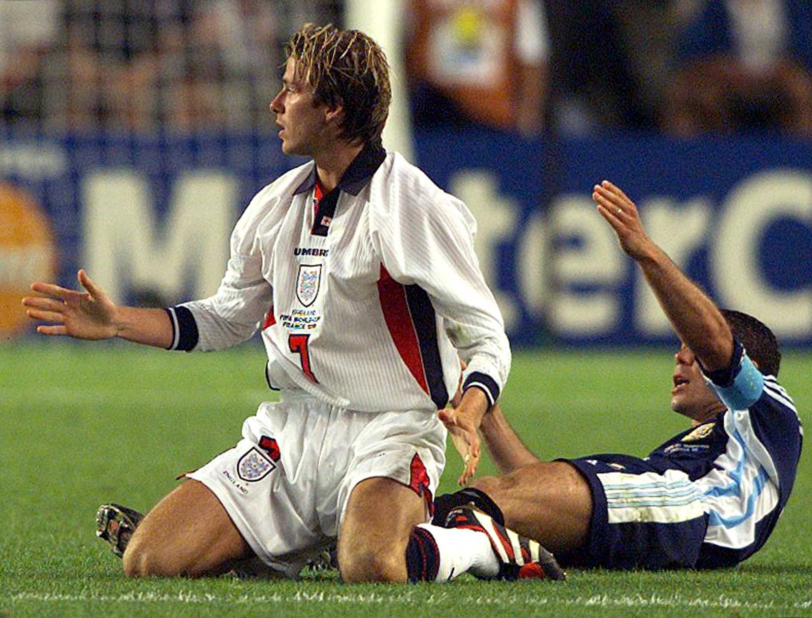 ENGLAND'S BECKHAM REACTS TO BOOKING.