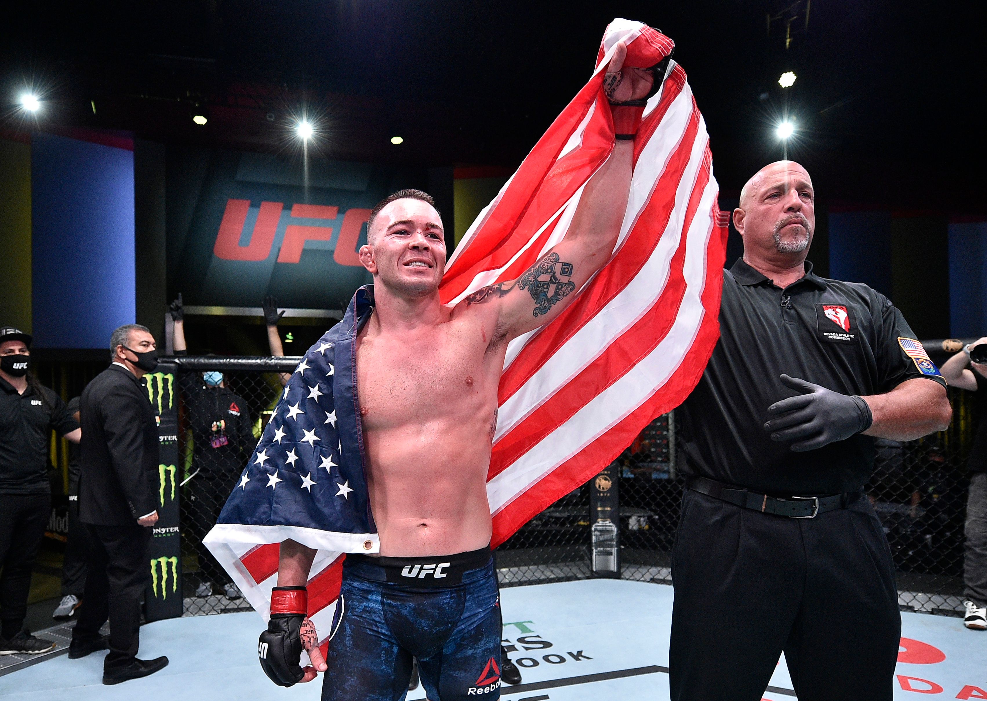 Colby Covington celebrating in the UFC octagon