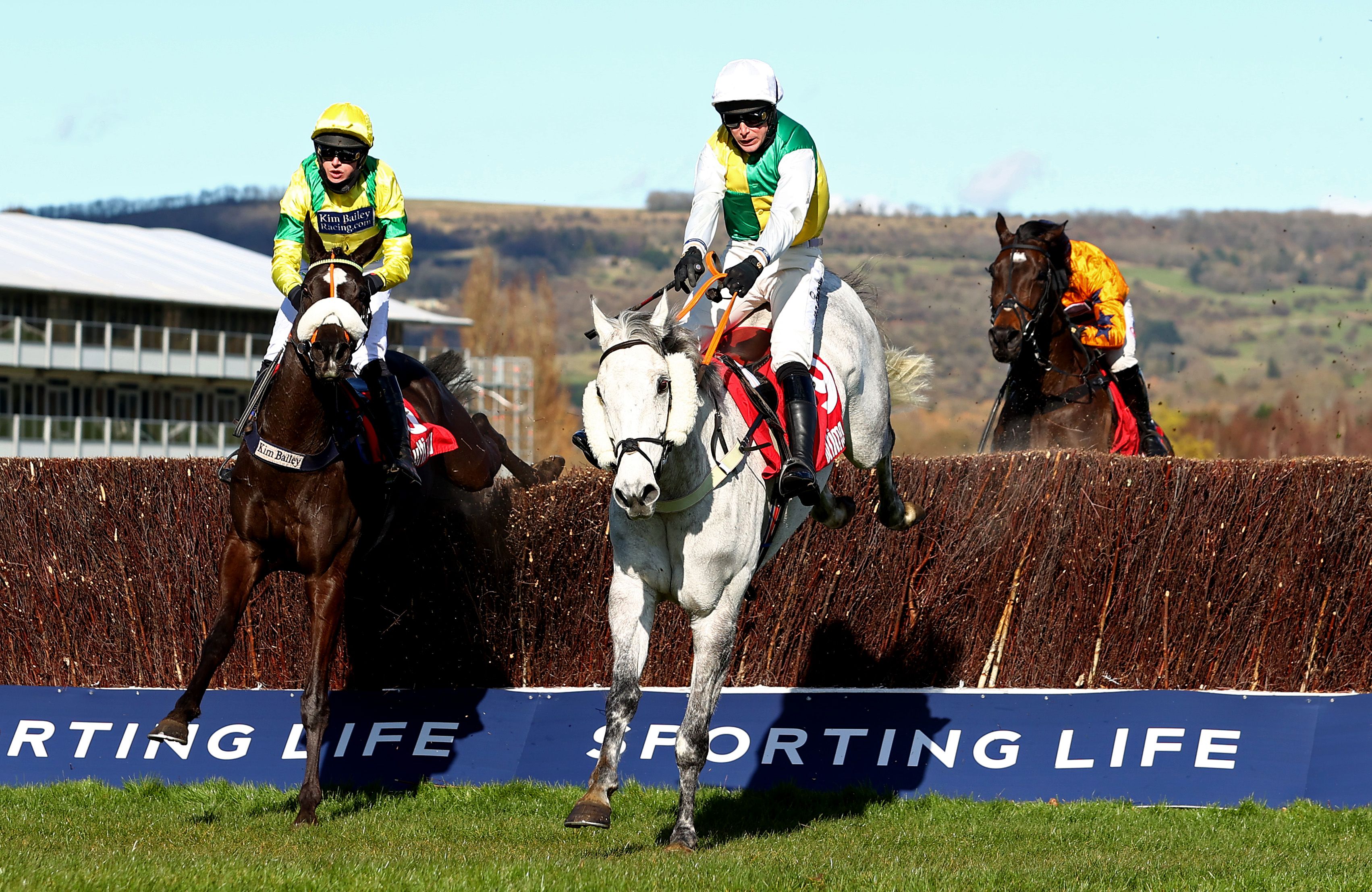 Vintage Clouds (R) ridden by Ryan Mania jumps the last to beat Happygolucky (L)