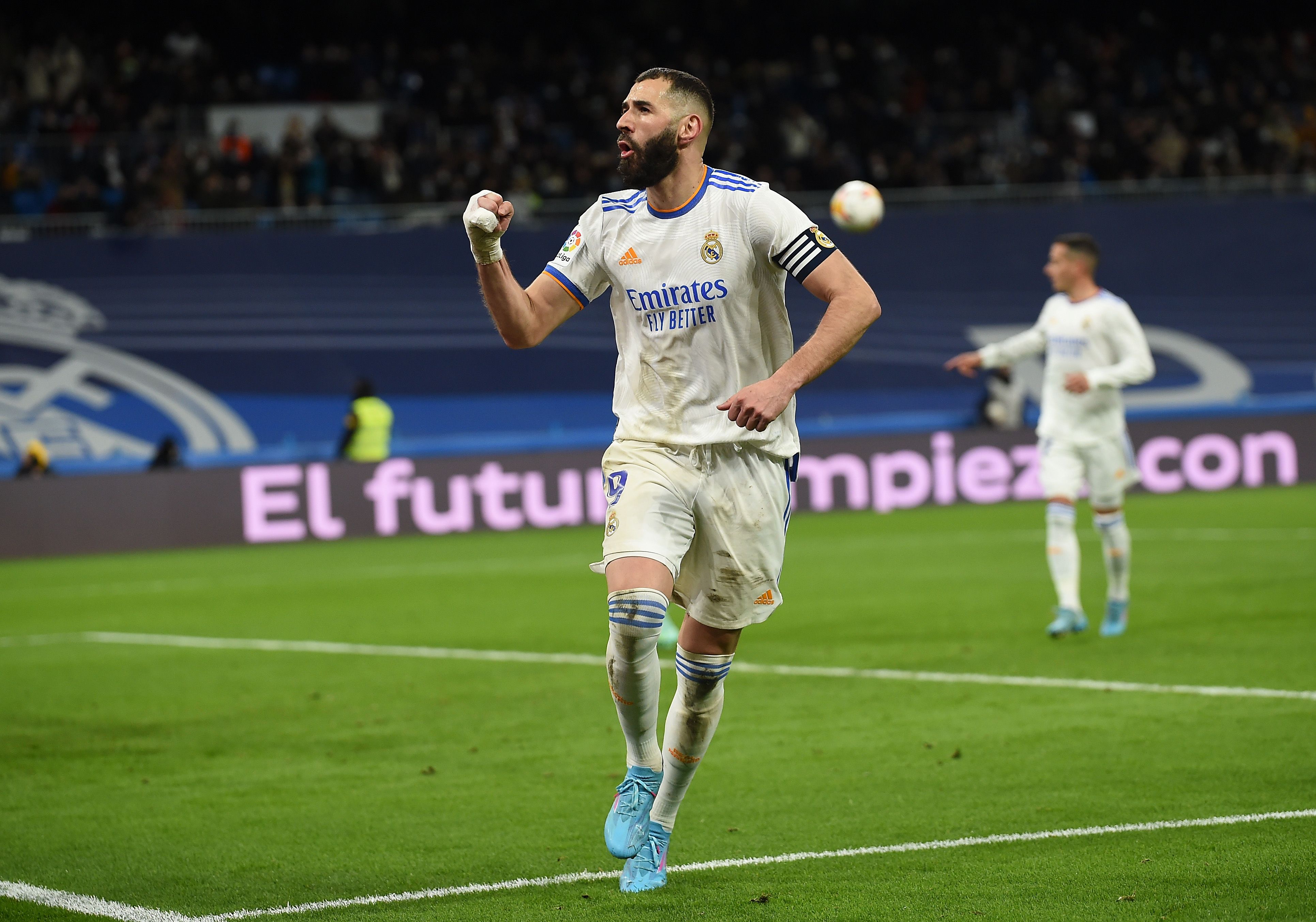 Karim Benzema of Real Madrid celebrates after scoring their team's third goal from the penalty spot during the LaLiga Santander match