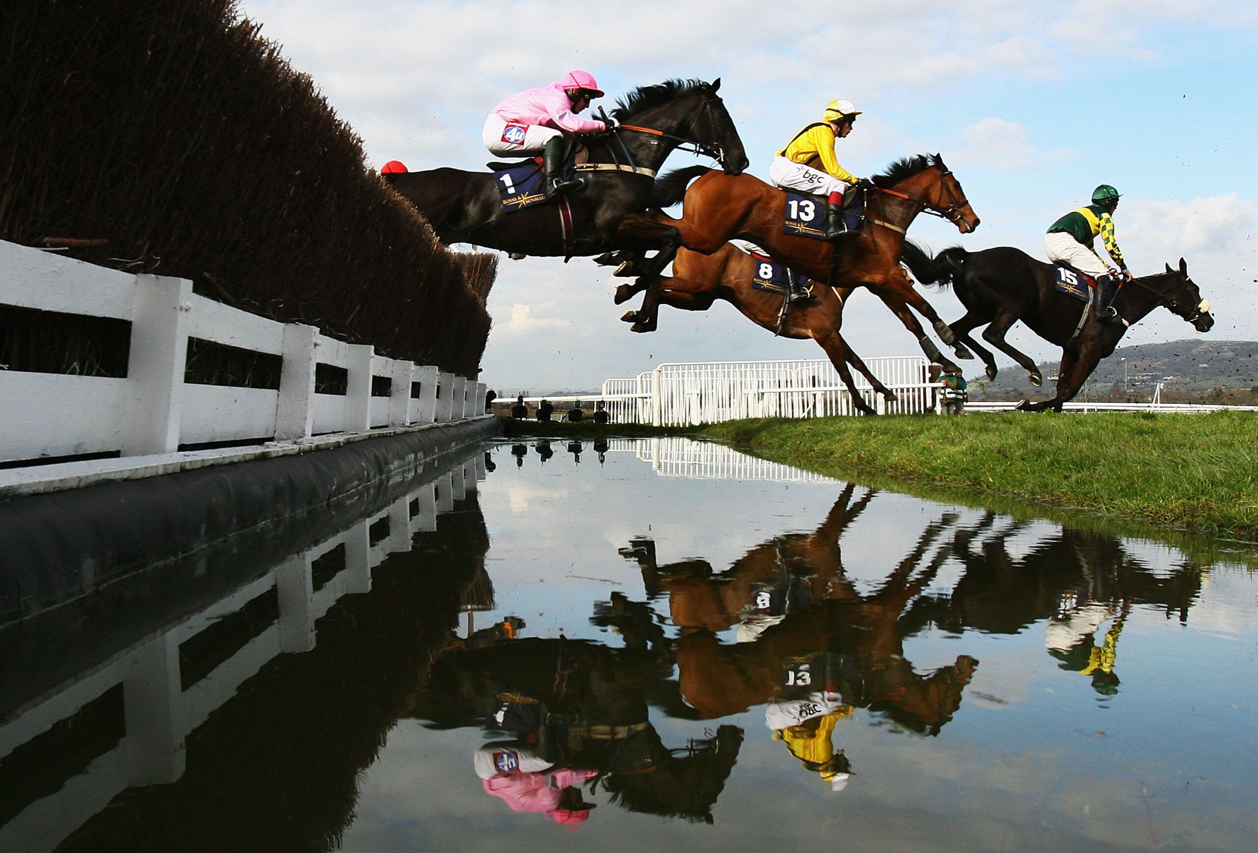Horses clear the water jump during the Royal Steeple Chase on the second day of The Annual National Hunt Festival