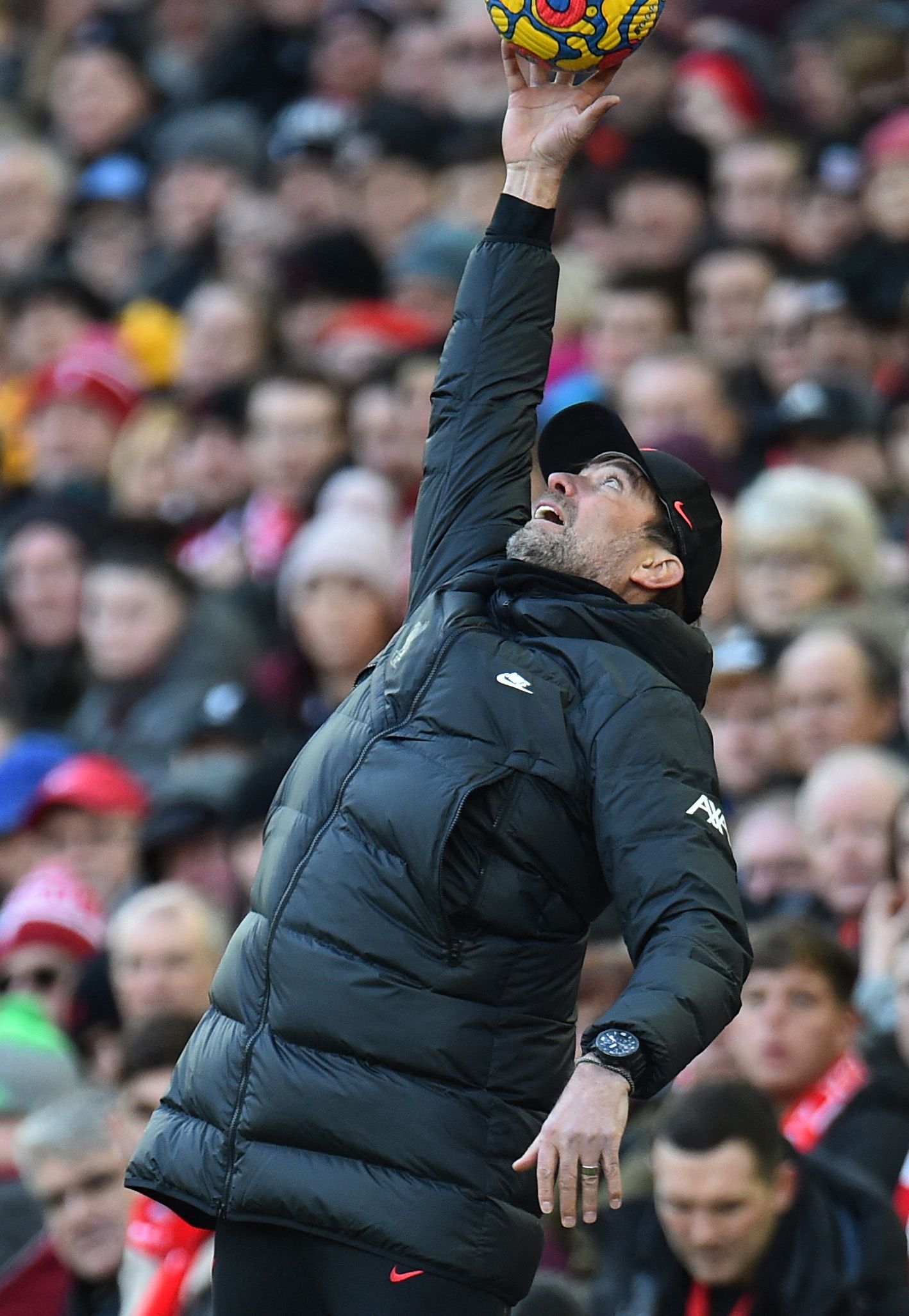 Liverpool's Klopp catches a ball.