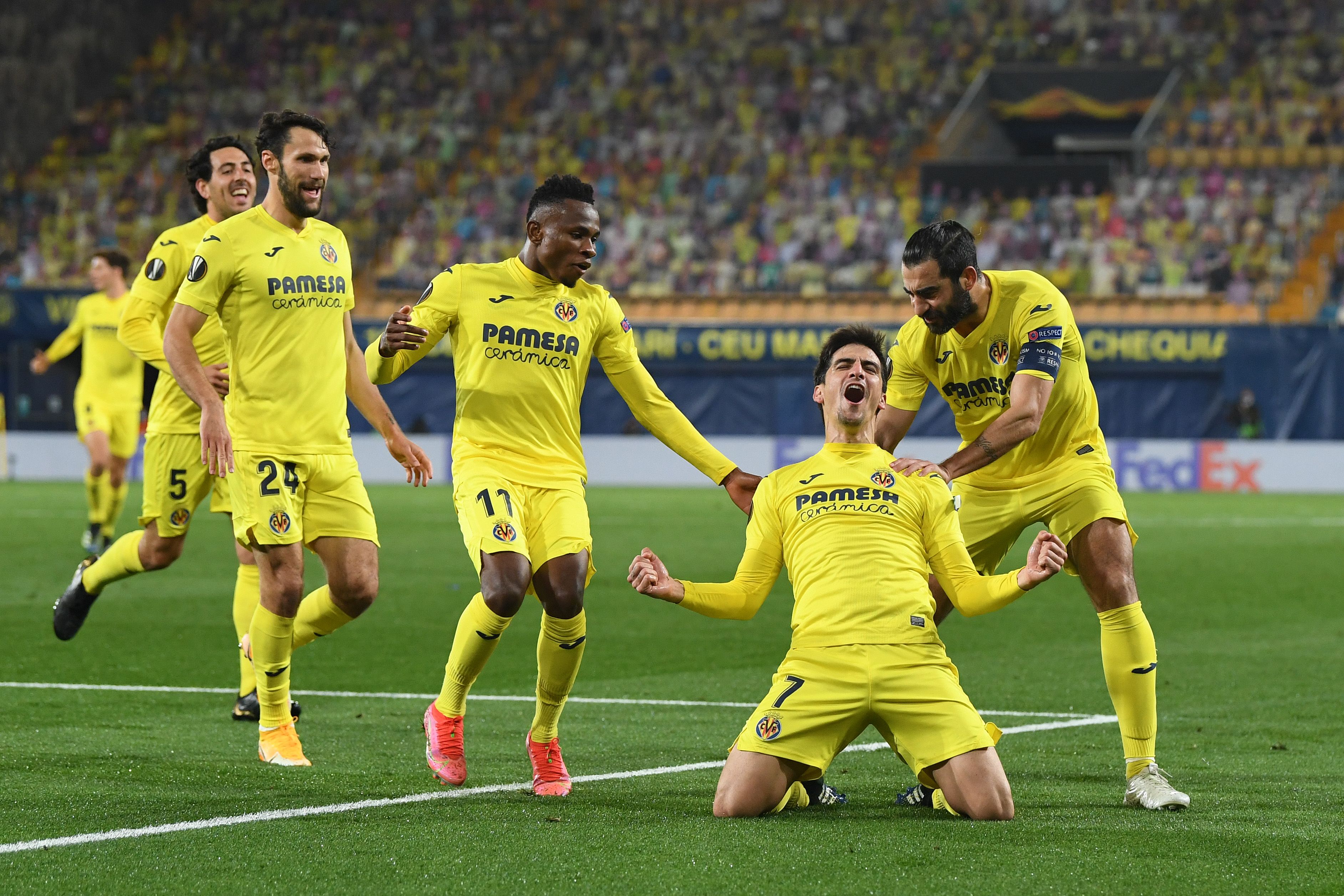 Gerard Moreno of Villarreal celebrates with teammates after scoring their team's second goal