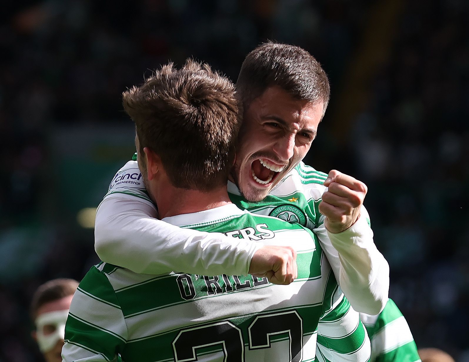 Matt O'Riley of Celtic celebrates with Josip Juranovic after scoring the fifth goal during the Cinch Scottish Premiership match between Celtic FC and St. Johnstone FC at Celtic Park on April 09, 2022