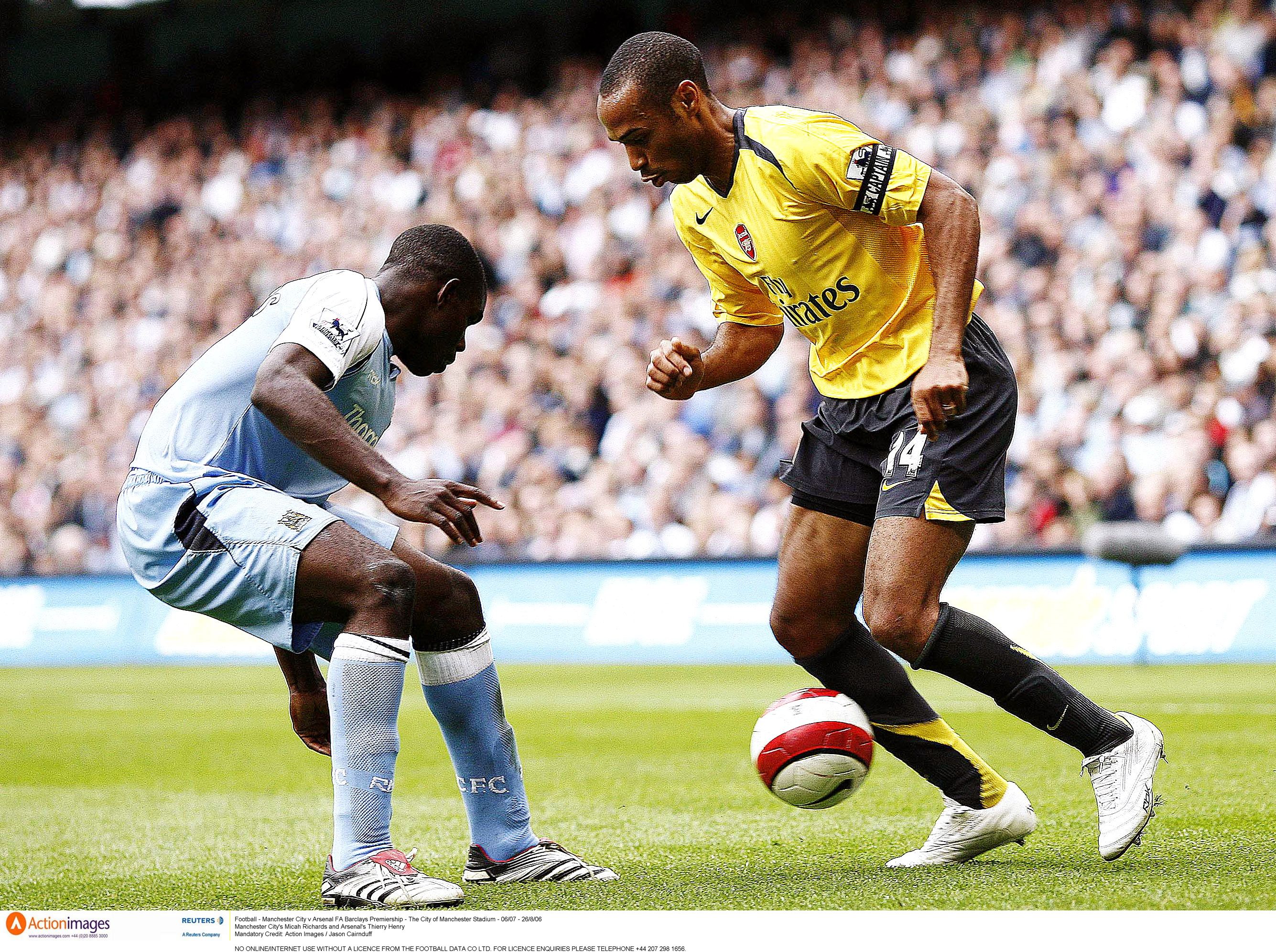 Thierry Henry and Micah Richards in action during Manchester City vs Arsenal in 2006