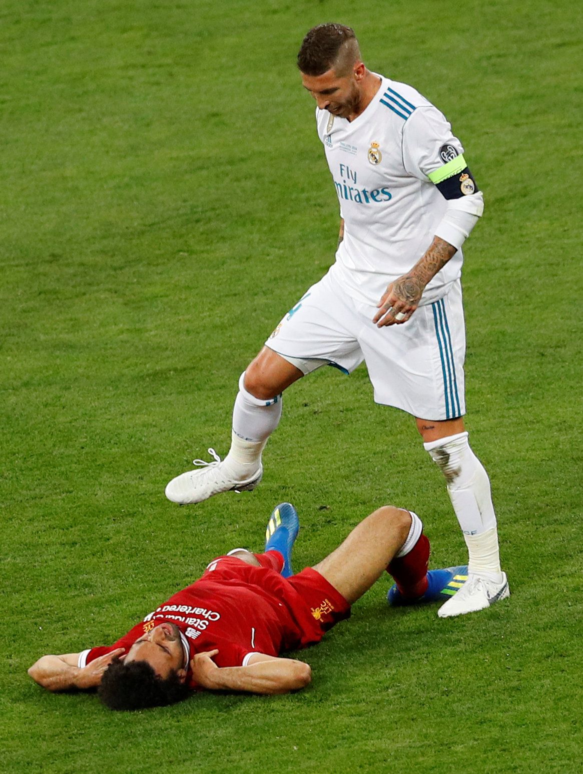 Ramos stands over Salah.