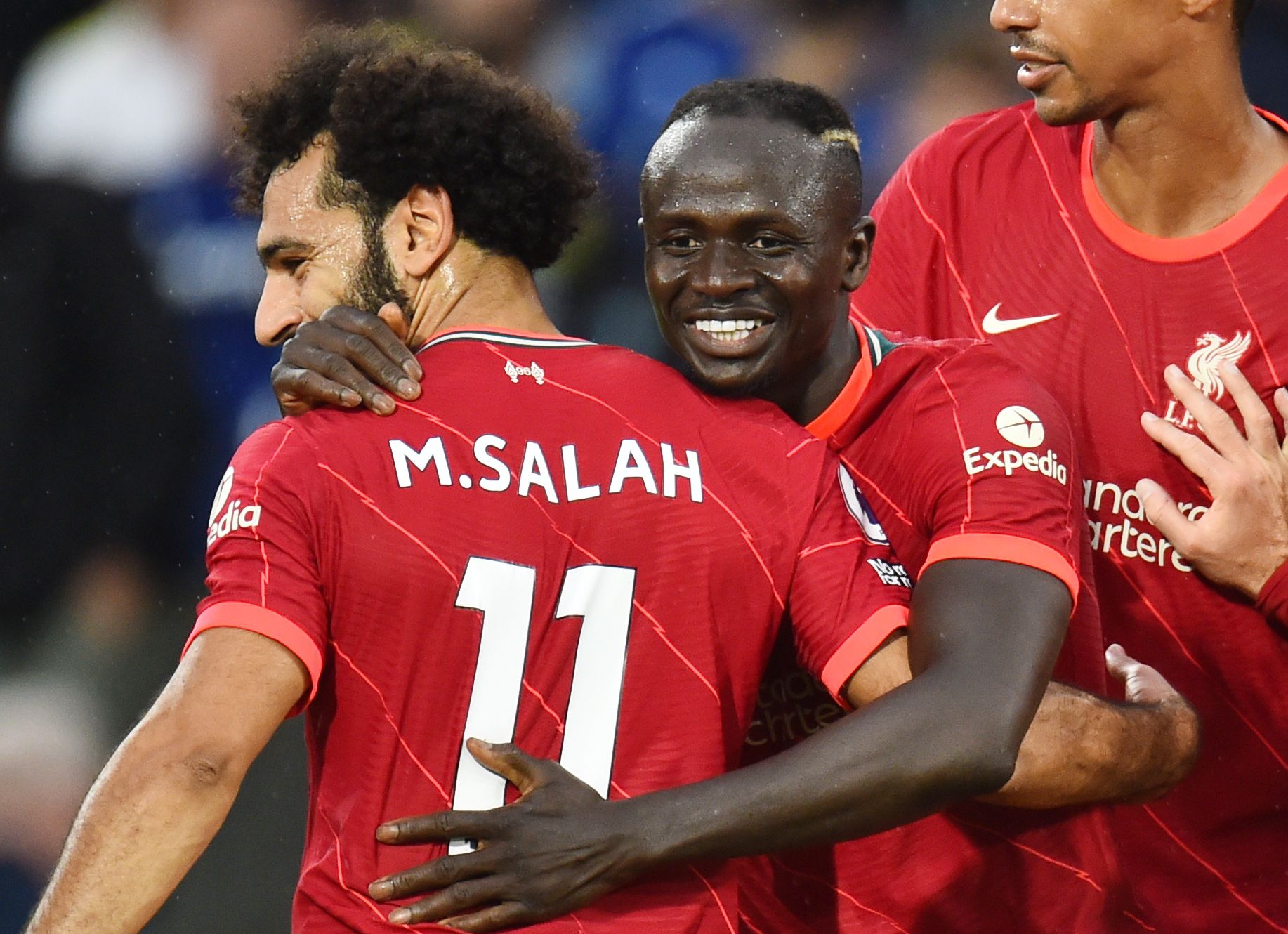 Liverpool's Mohamed Salah and Sadio Mane embrace.