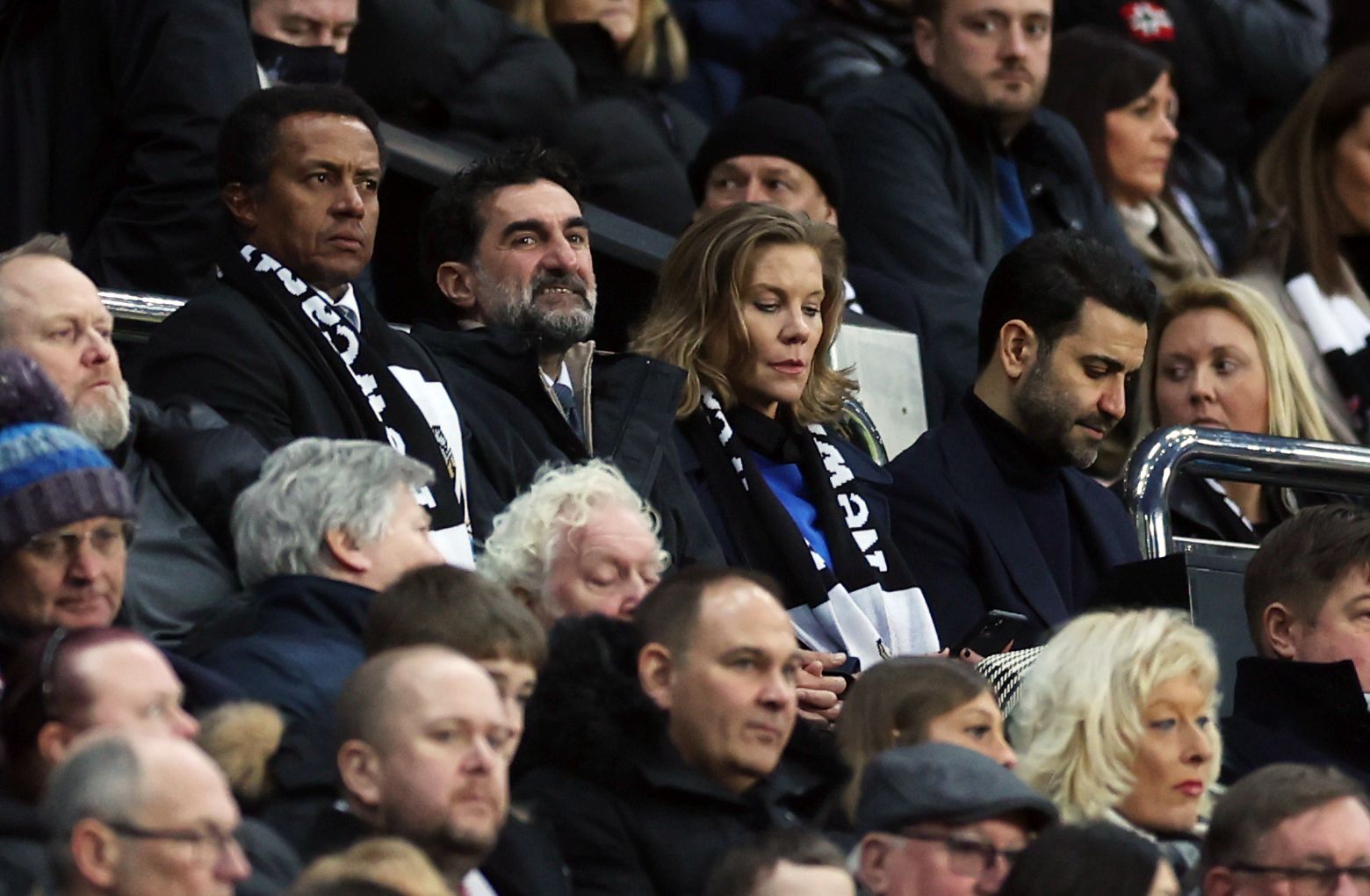 Newcastle's owners watch on.