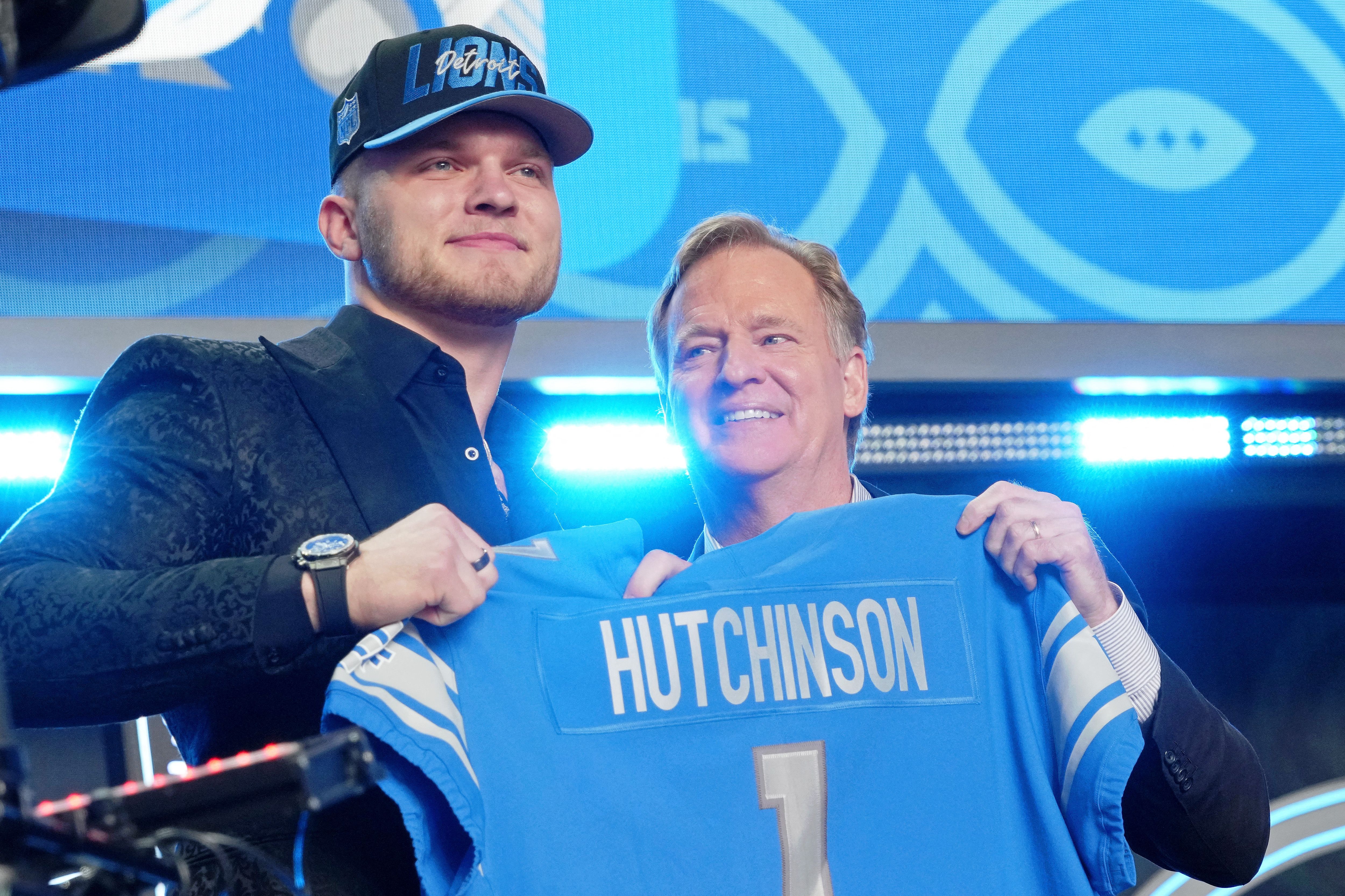 Michigan defensive end Aidan Hutchinson with NFL commissioner Roger Goodell after being selected as the second overall pick to the Detroit Lions during the first round of the 2022 NFL Draft 