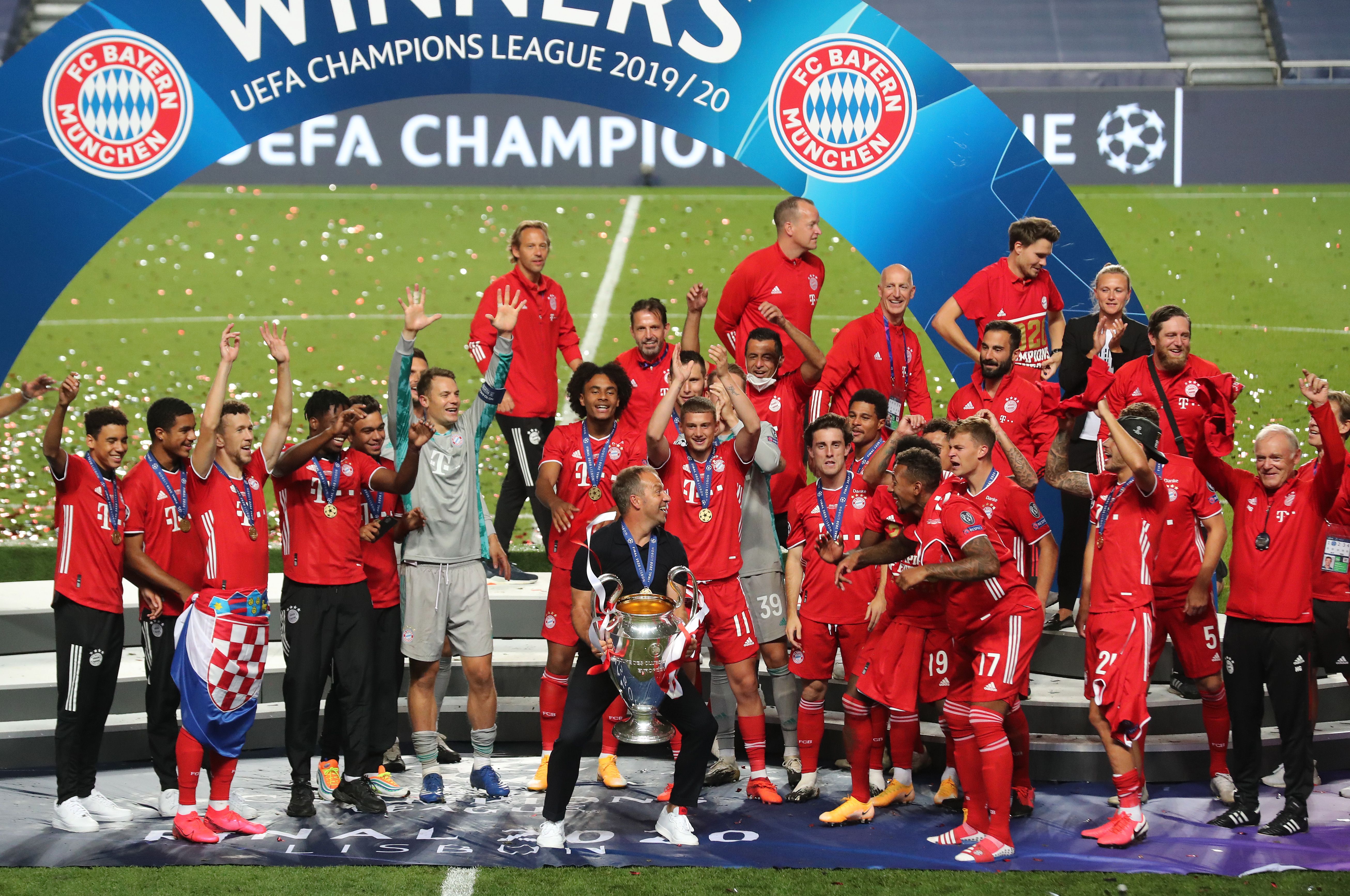 Bayern Munich celebrates with the UEFA Champions League Trophy following their victory against PSG.