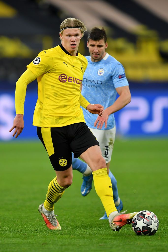 Borussia Dortmund's Erling Haaland &amp; Man City's Ruben Dias in action