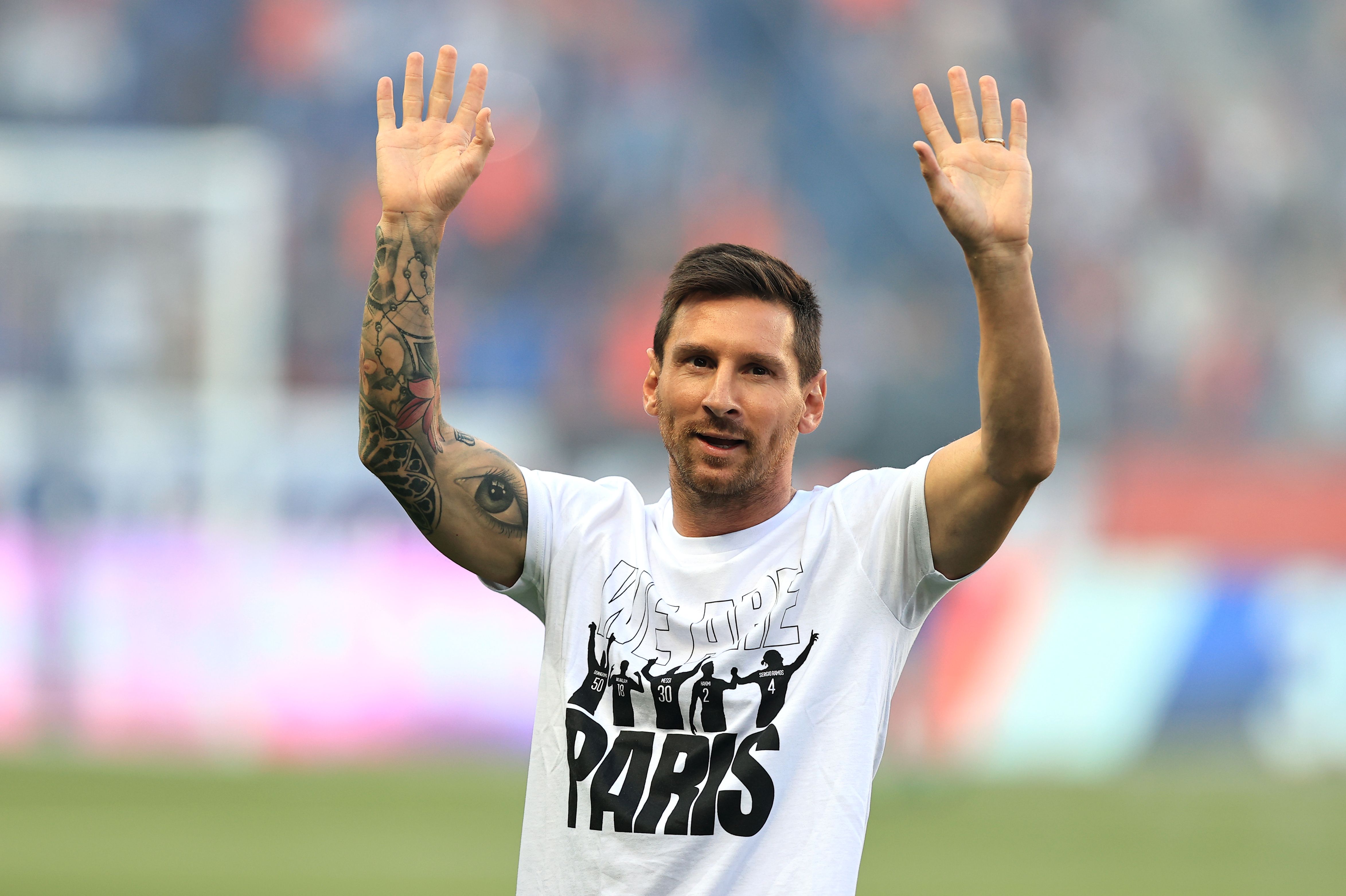 Lionel Messi waves to fans