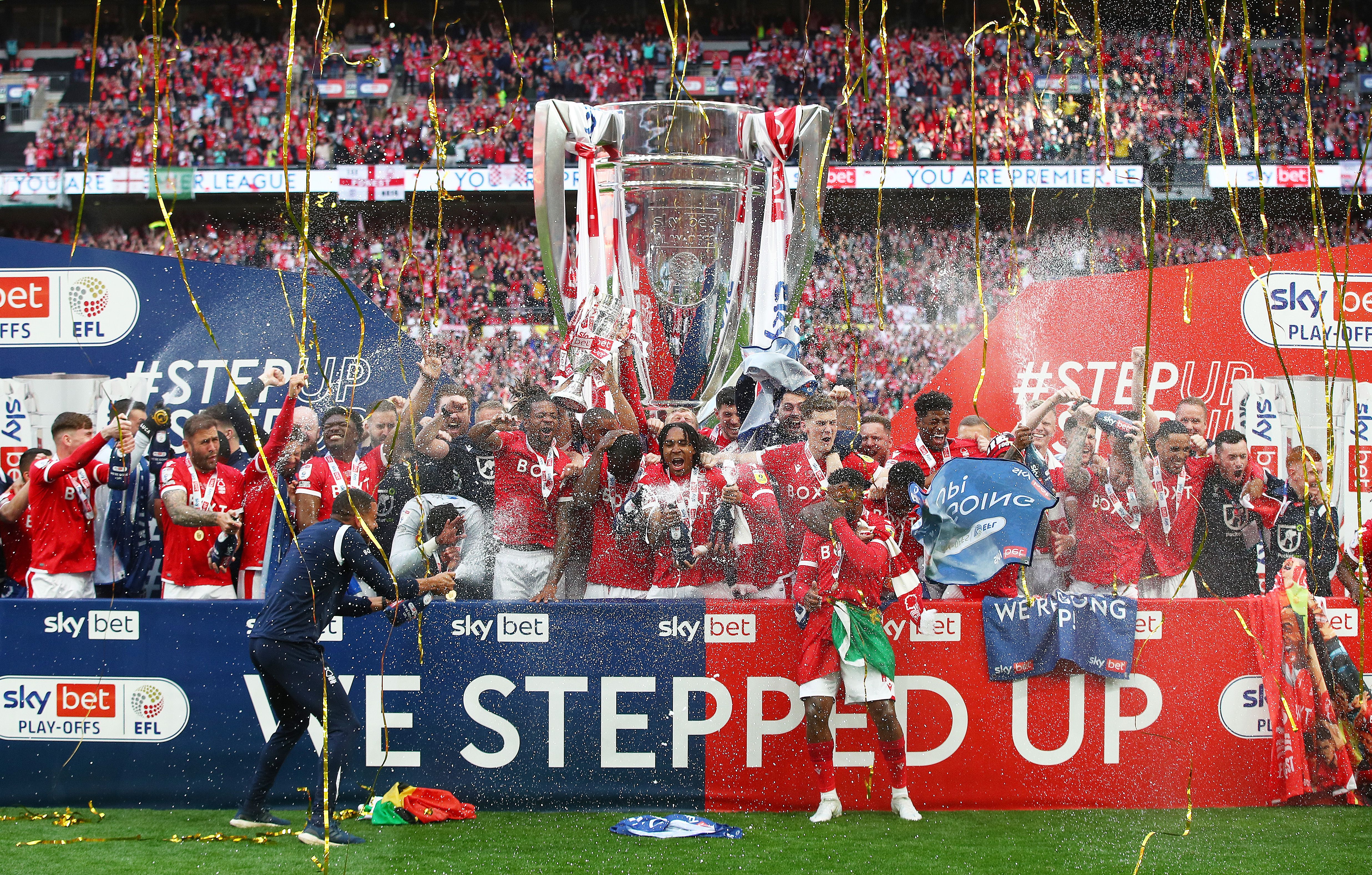 ewis Grabban of Nottingham forest lifts the trophy following their team's victory in the Sky Bet Championship Play-Off Final match between Huddersfield Town and Nottingham Forest at Wembley Stadium on May 29, 2022 in London, England