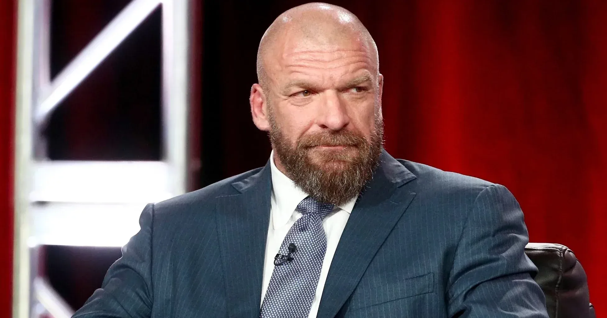 Triple H WWE on red chair