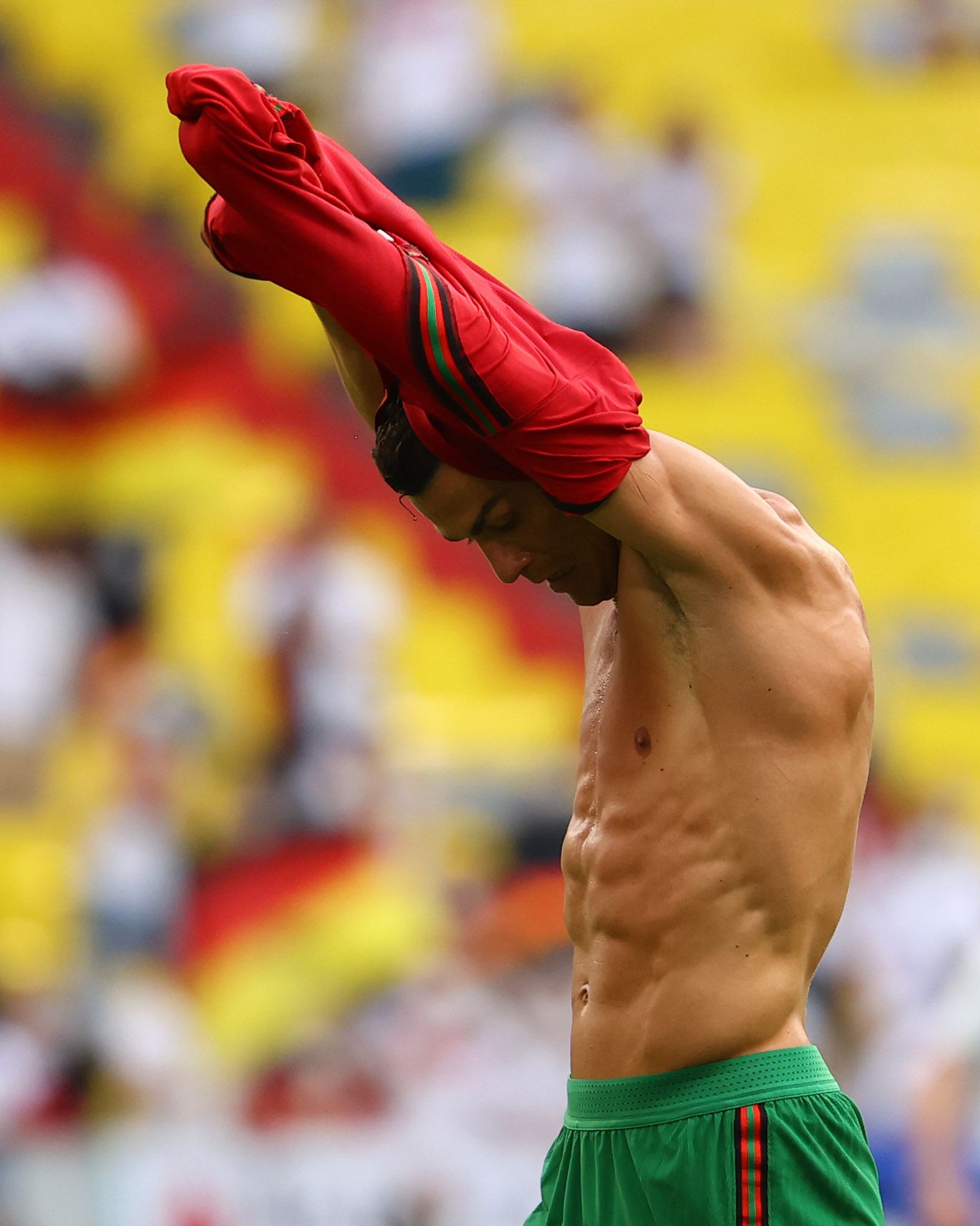 Ronaldo removes his shirt.