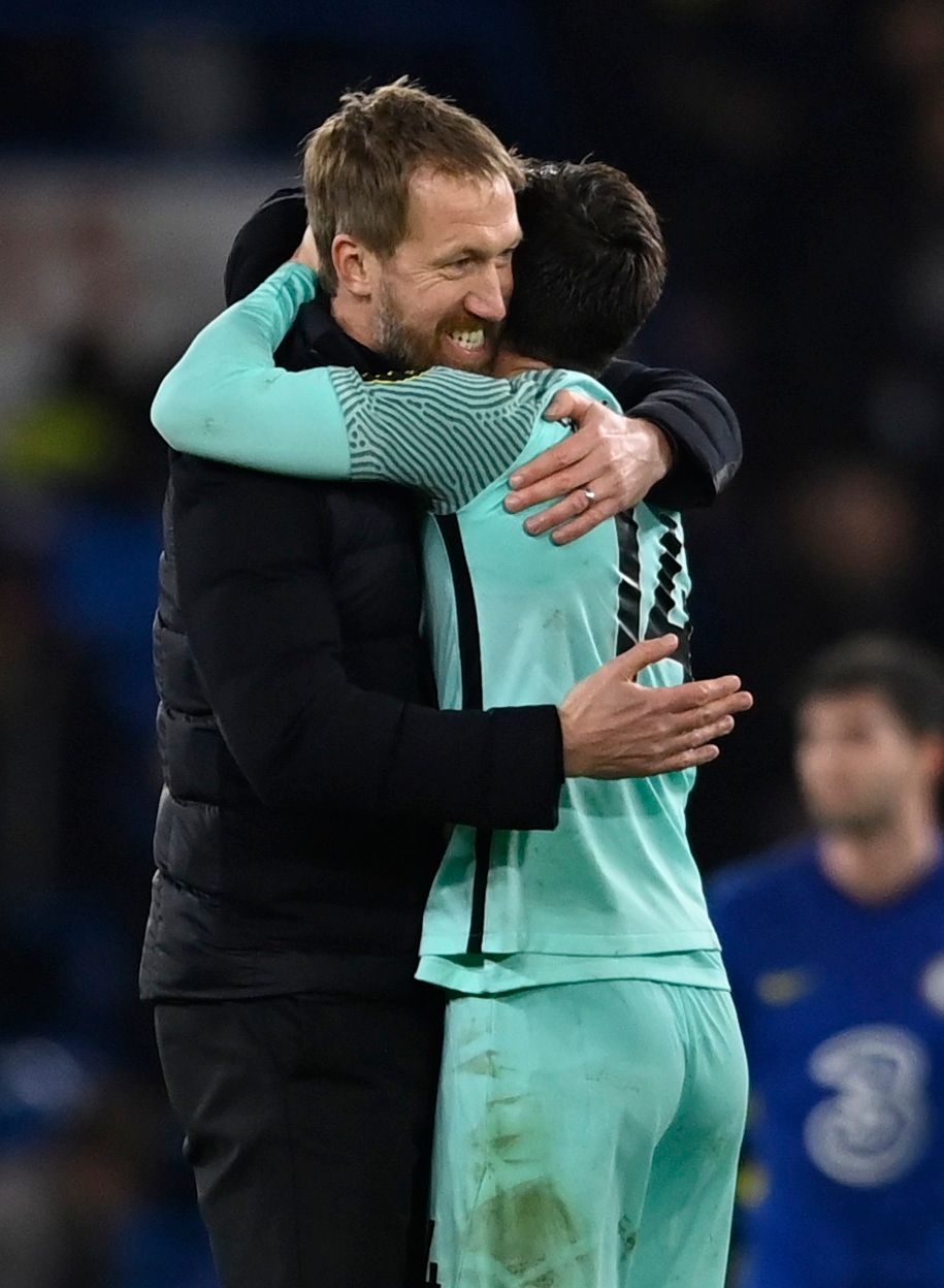 Potter and Lallana embrace.